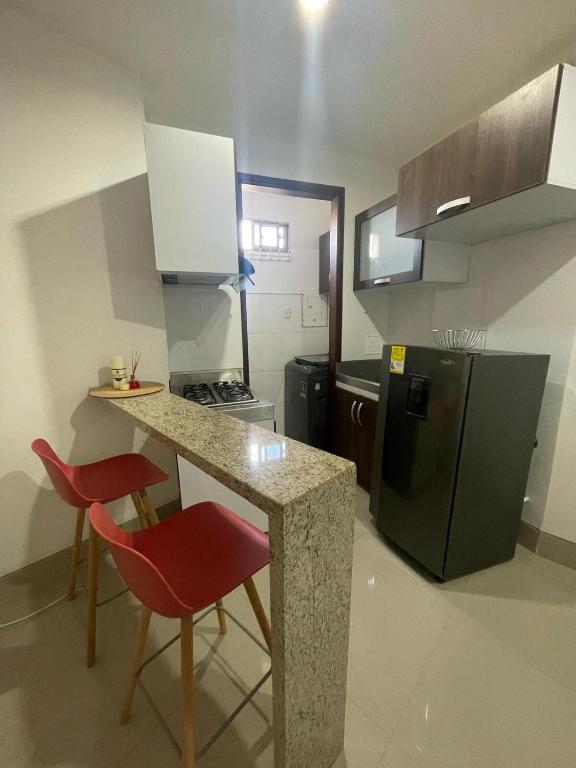Kuchyň nebo kuchyňský kout v ubytování Excelente apartaestudio