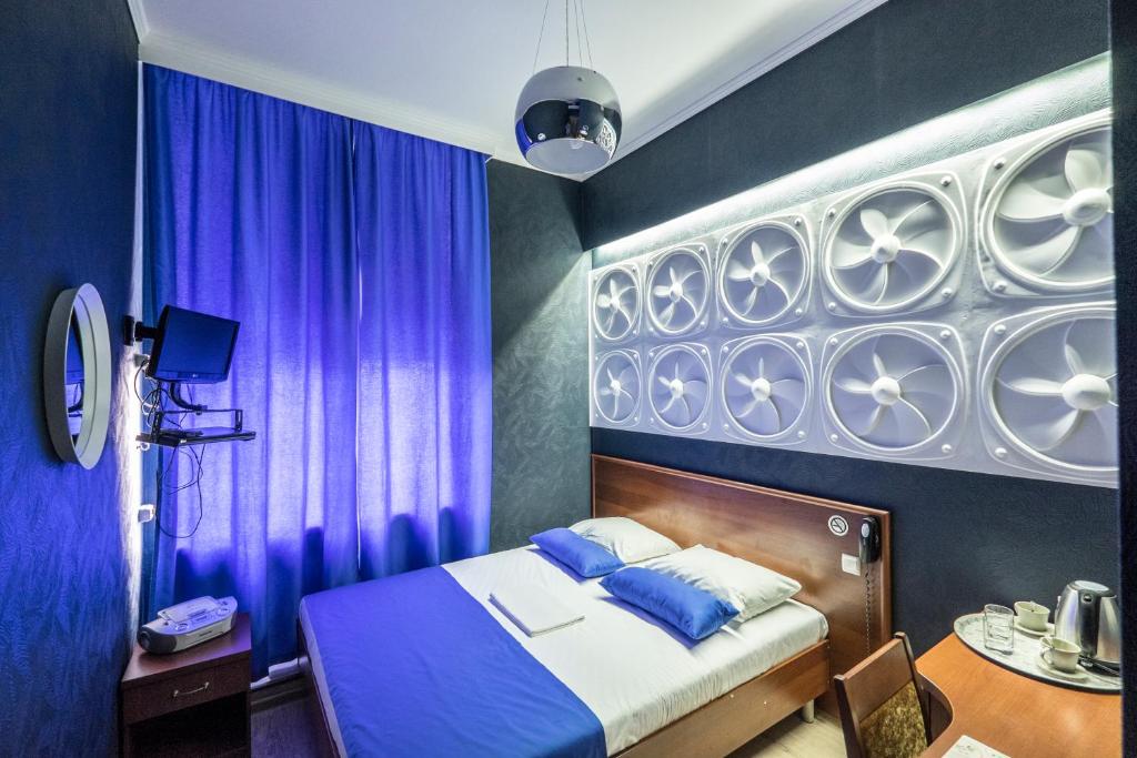 
Кровать или кровати в номере Погости на Ленинградском проспекте
