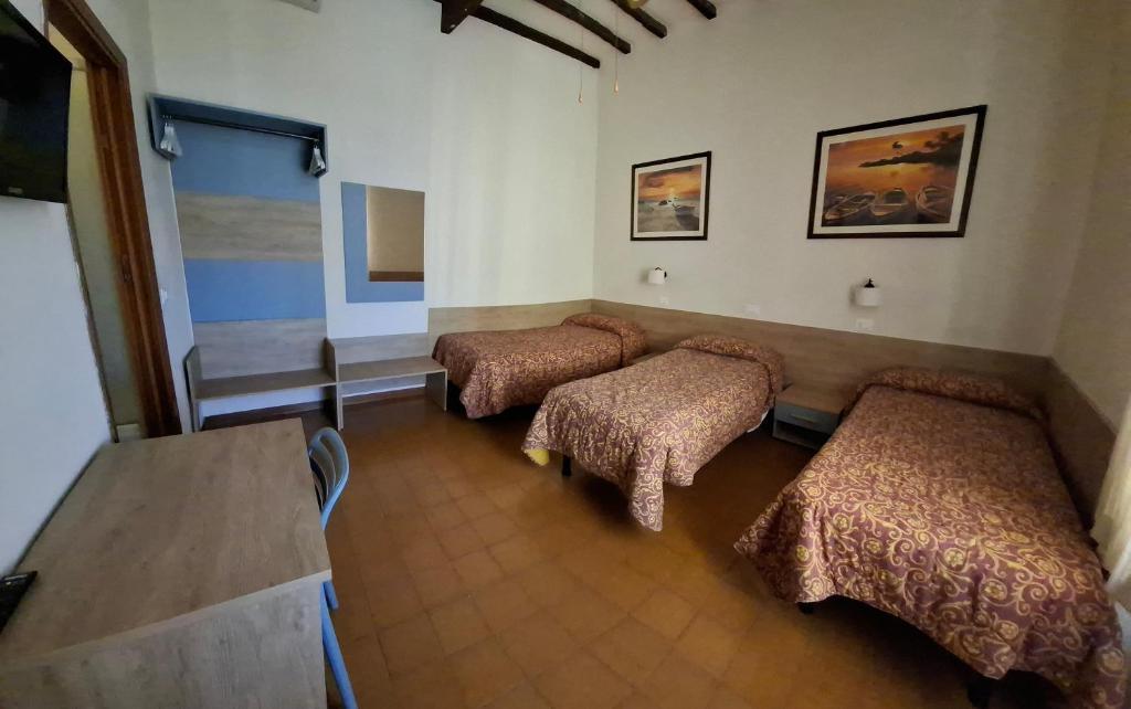 Postel nebo postele na pokoji v ubytování Hotel Lea