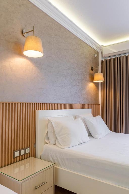 Postel nebo postele na pokoji v ubytování Hotel Mira Mare