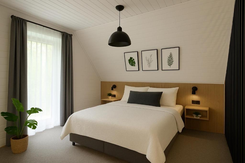 Postel nebo postele na pokoji v ubytování Resort EDEN - domki, pokoje, apartamenty, sauna, jacuzzi