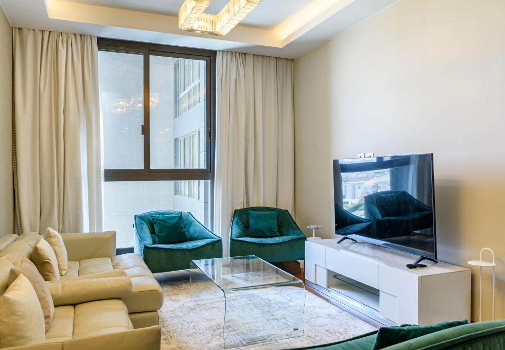 TV a/nebo společenská místnost v ubytování VESTA - El Sheikh Zayed Residence