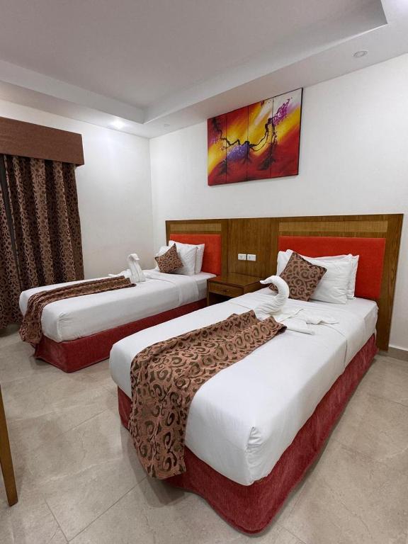 Postel nebo postele na pokoji v ubytování Petra Rocks Hotel