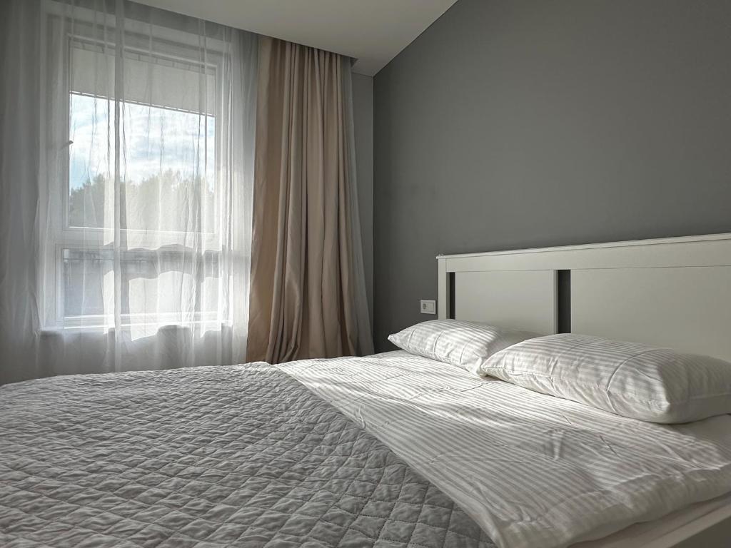 Postel nebo postele na pokoji v ubytování Lazdyneliu Vingis Vilnius "Good Choice" Apartment - Self check-in