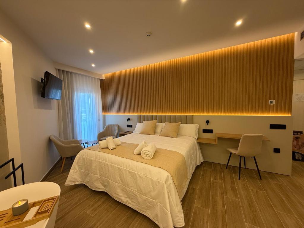 Postel nebo postele na pokoji v ubytování Hotel Siskets
