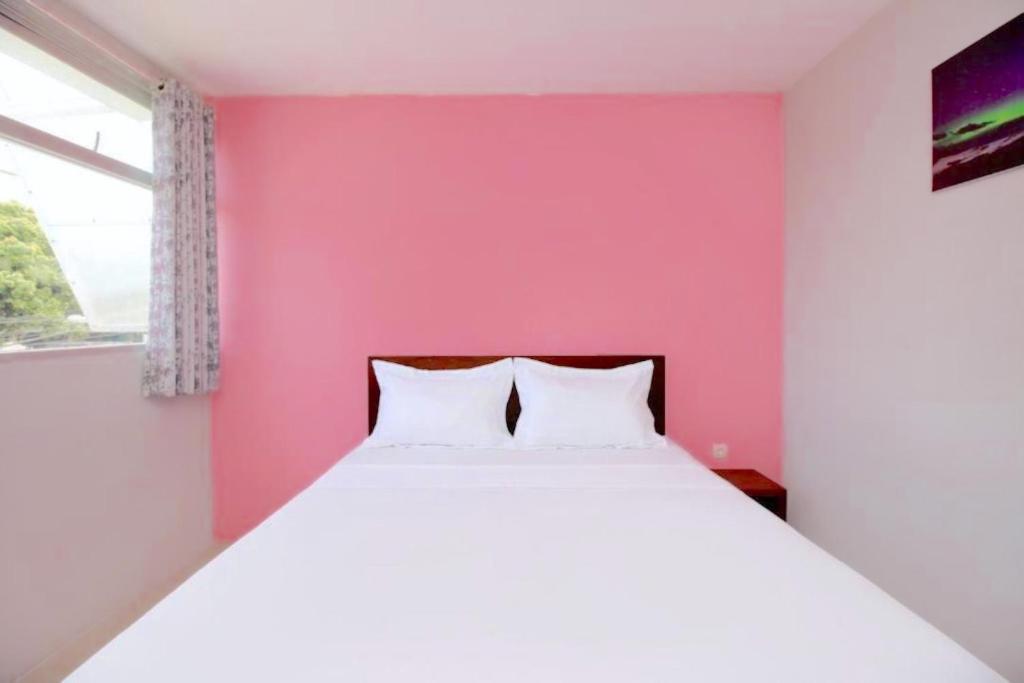 Letto o letti in una camera di The Aurora by Makati