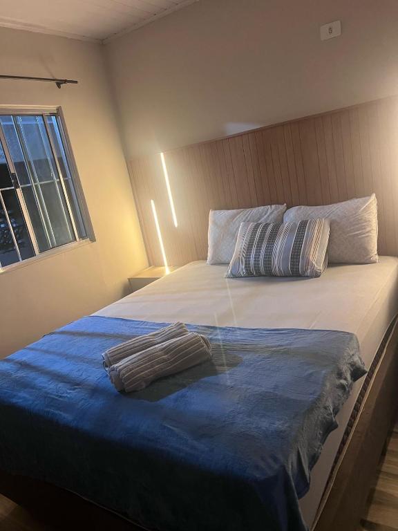 Postel nebo postele na pokoji v ubytování Casa Av parana