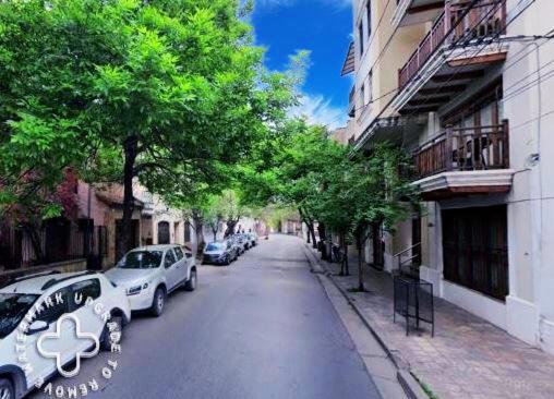 a street with cars parked on the side of the road at Departamento San Bernardo - Céntrico Salta in Salta