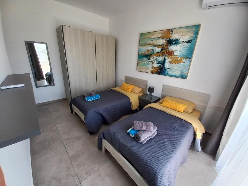 Letto o letti in una camera di Yellow Hill Penthouse