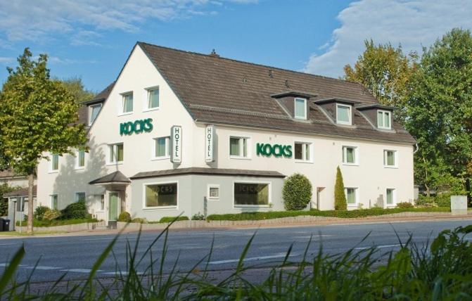 a large white building with the words roros on it at Kocks Hotel Garni in Hamburg