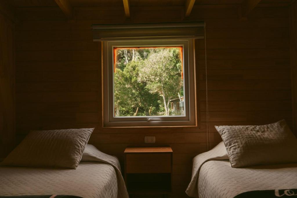 Cama o camas de una habitación en Indómito Refugio
