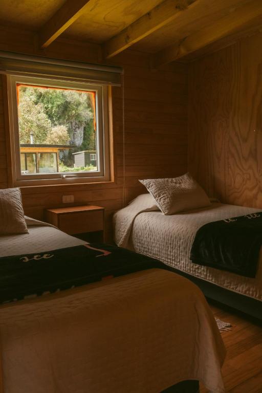 Cama o camas de una habitación en Indómito Refugio