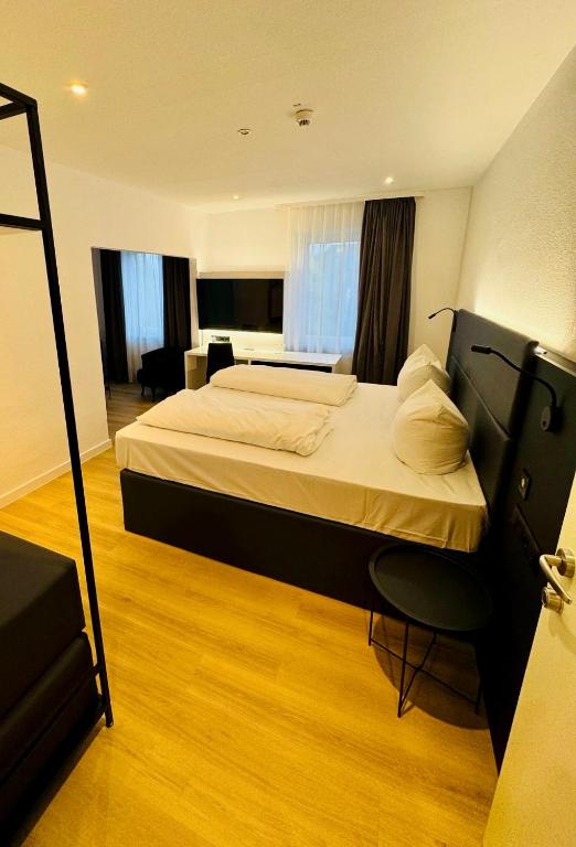Postel nebo postele na pokoji v ubytování DORMERO Hotel Wilhelmshaven