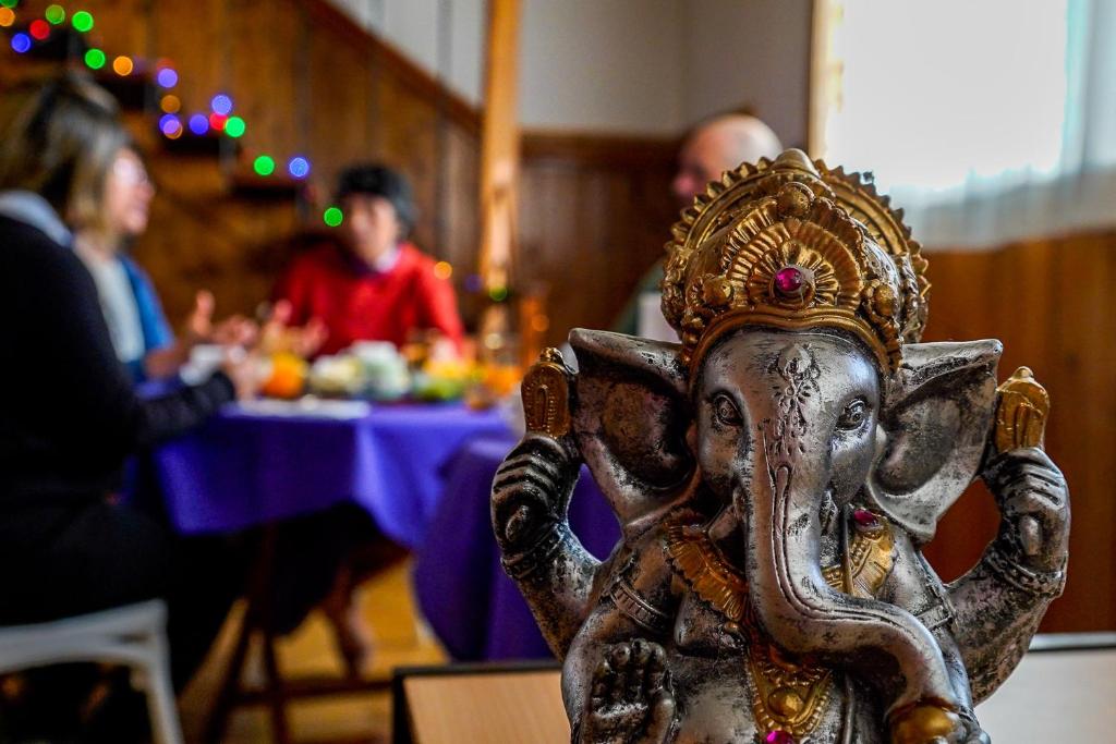 a statue of an elephant wearing a crown at Re-Crearte Centro Holístico in San Carlos de Bariloche
