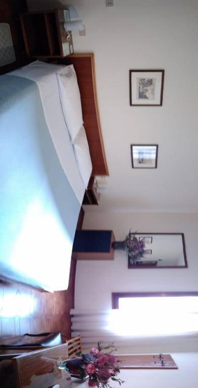 Postel nebo postele na pokoji v ubytování Albergo Al Gobbo