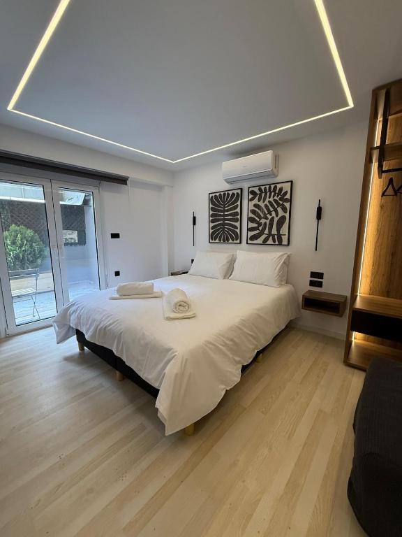 Postel nebo postele na pokoji v ubytování Elian Center Suite