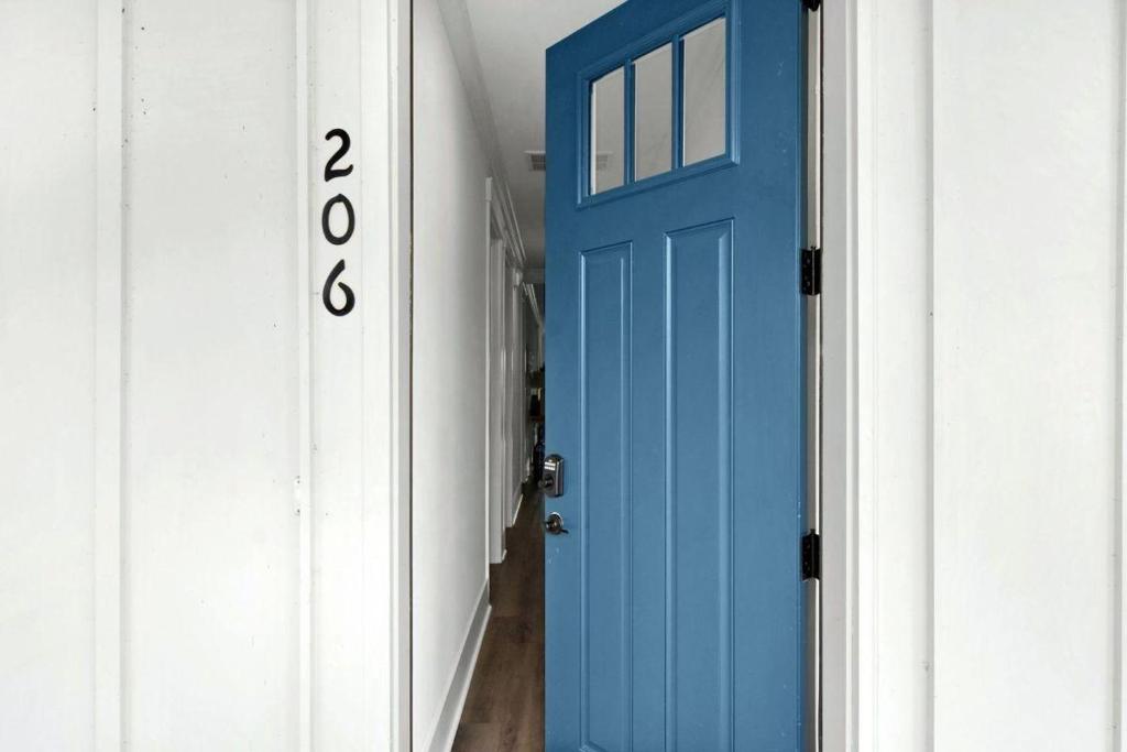 a blue door in a hallway with a house number at Moorings 206 in Jekyll Island