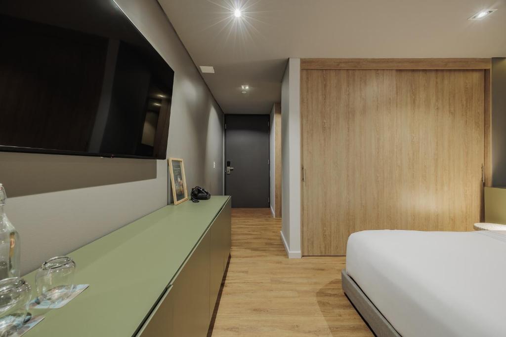 Postel nebo postele na pokoji v ubytování Versus Hotel
