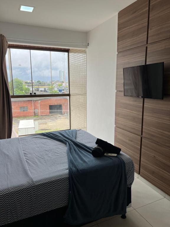 En eller flere senge i et værelse på Flat alto padrão na melhor localização da cidade