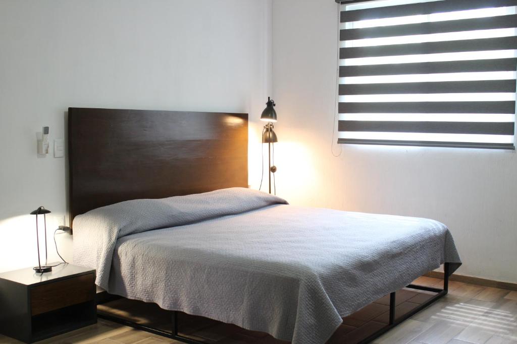 Postel nebo postele na pokoji v ubytování Lofts Las Fuentes