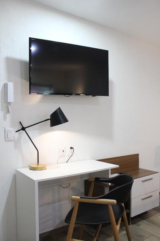 TV a/nebo společenská místnost v ubytování Lofts Las Fuentes