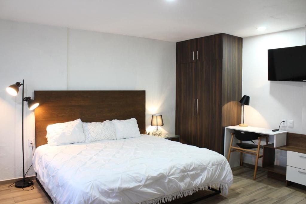 Postel nebo postele na pokoji v ubytování Lofts Las Fuentes