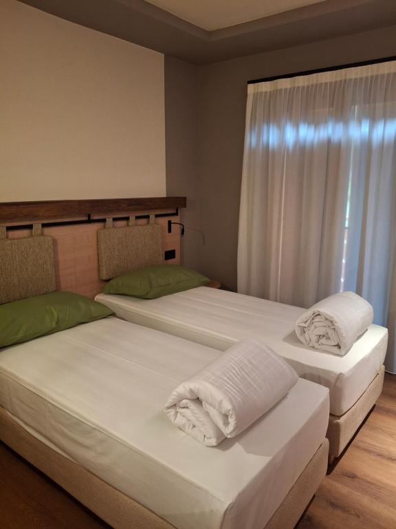 Postel nebo postele na pokoji v ubytování Hotel Dolomiti Saone