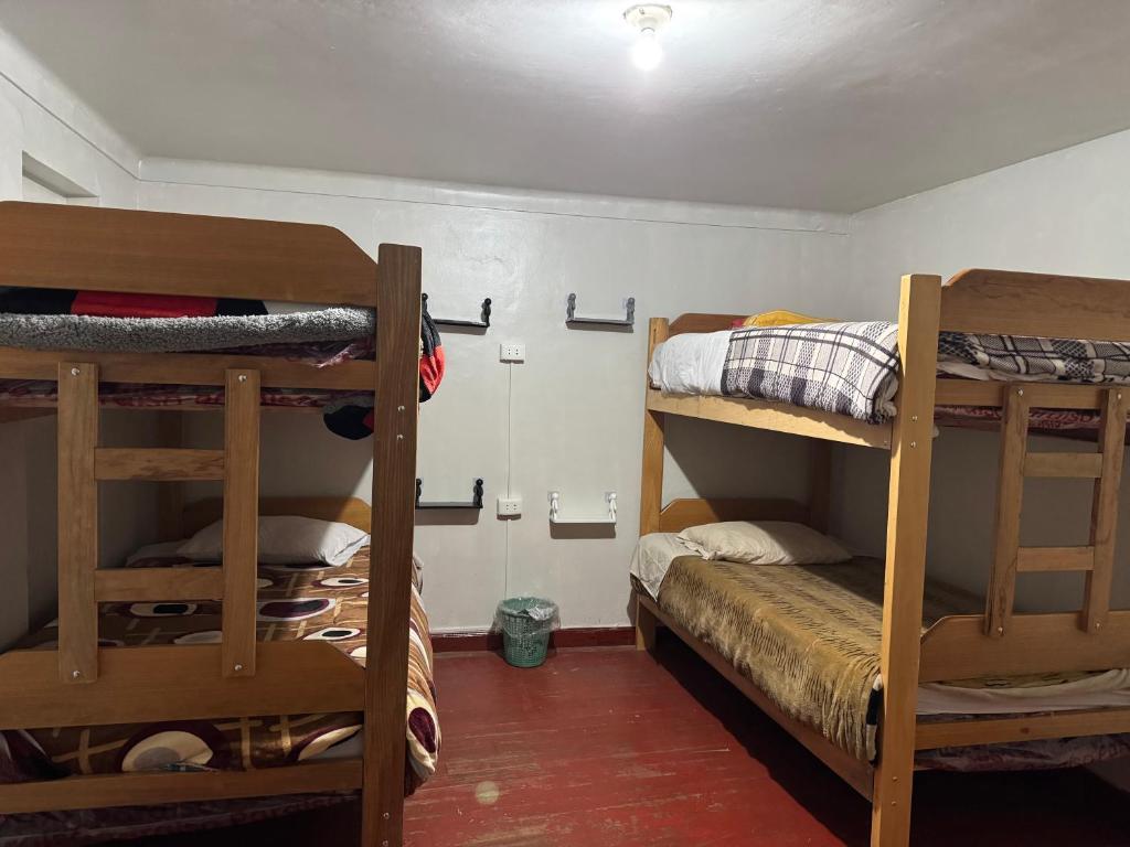 Postel nebo postele na pokoji v ubytování Ukumari Hostel