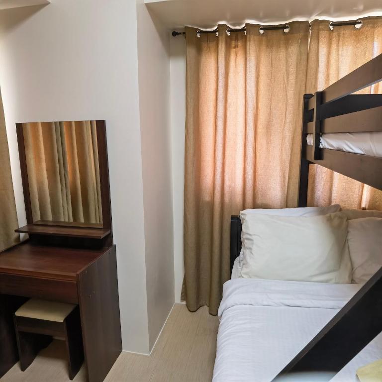 Postel nebo postele na pokoji v ubytování Avida Davao by davaobnb & Lemonique Homes