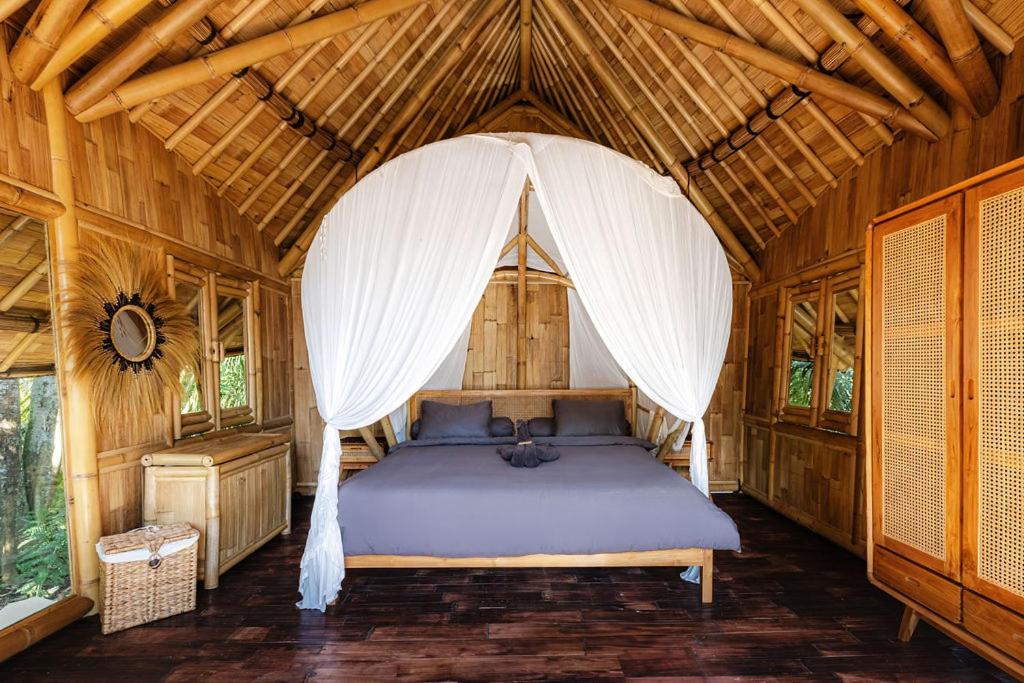 Ένα ή περισσότερα κρεβάτια σε δωμάτιο στο Maya Eco Retreat Bamboo Hotel