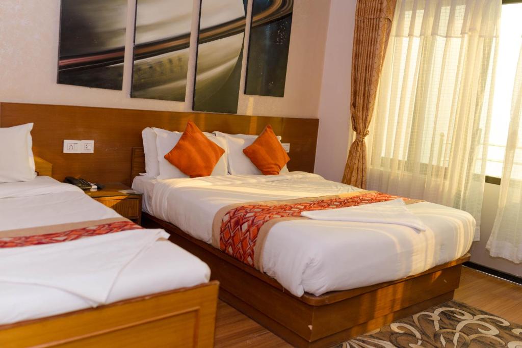 Postel nebo postele na pokoji v ubytování Bojinee Resort