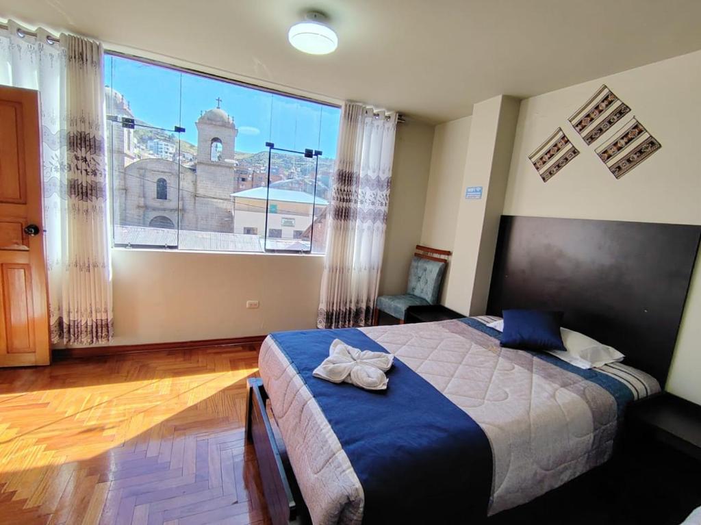 Postel nebo postele na pokoji v ubytování Hostal San Antonio Inn