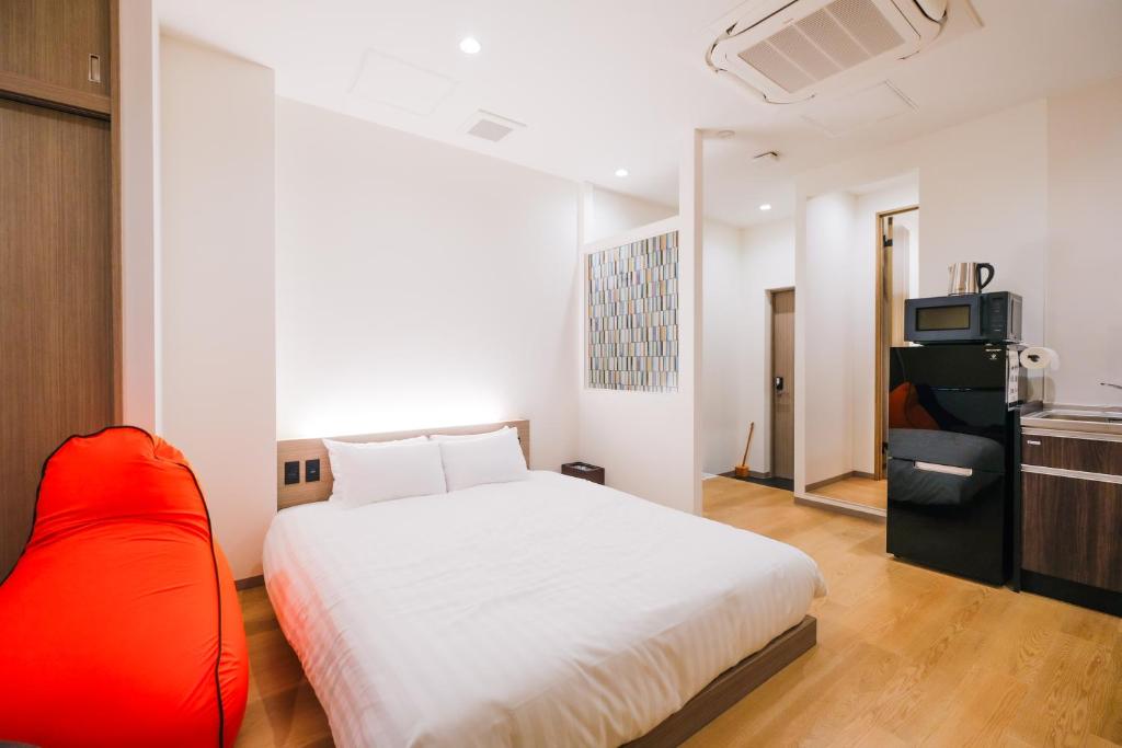 Ένα ή περισσότερα κρεβάτια σε δωμάτιο στο HOTEL ALL IN Kumamoto