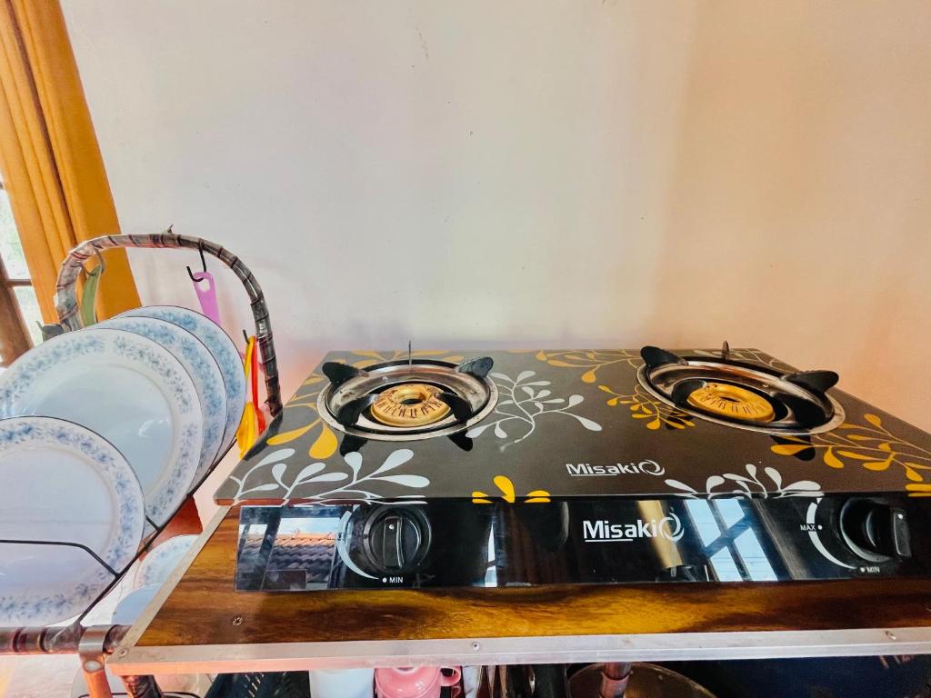 a stove sitting on top of a shelf at Ceylon Waves Weligama in Weligama