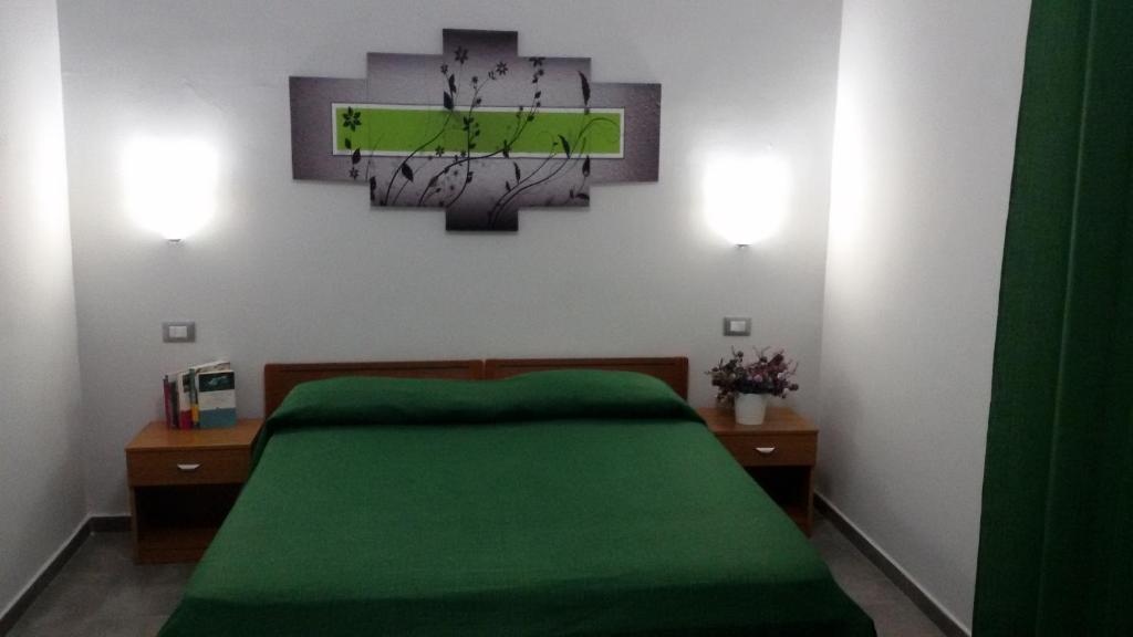 Postel nebo postele na pokoji v ubytování B&B HF Fiorella