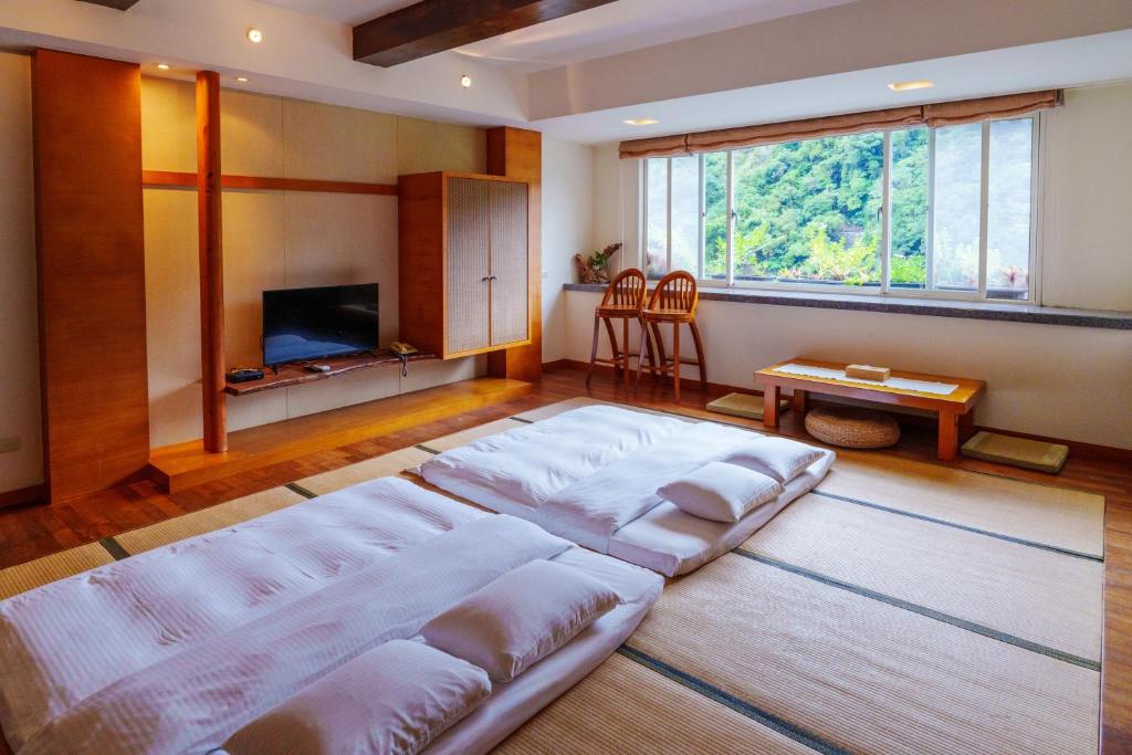Postel nebo postele na pokoji v ubytování Spring Spa Hotel