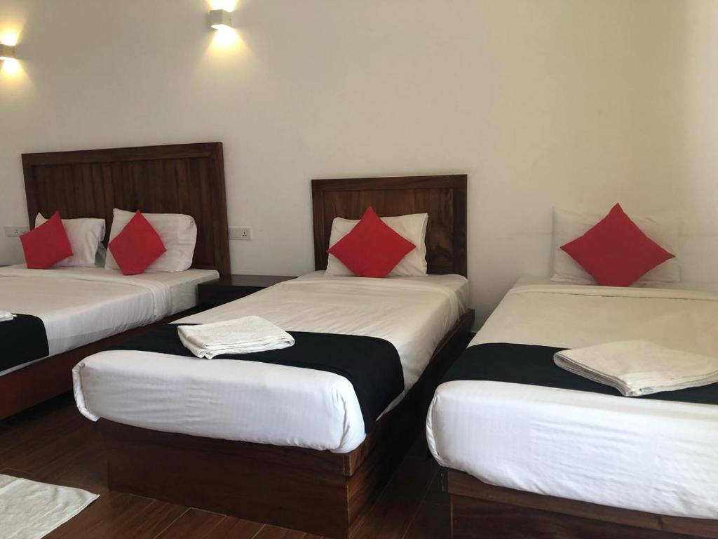 Postel nebo postele na pokoji v ubytování Capital Wind Beach Cabanas