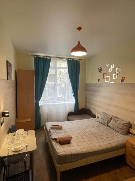 Posteľ alebo postele v izbe v ubytovaní Doba In Ua Studio Irpin Apartments