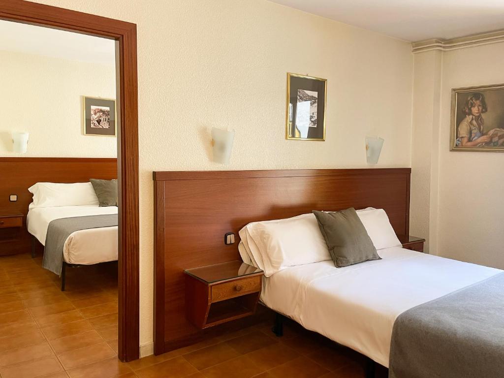 Postel nebo postele na pokoji v ubytování Hotel Coray by Pierre & Vacances