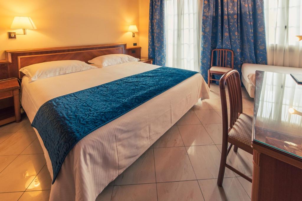Postel nebo postele na pokoji v ubytování Hotel Bettina