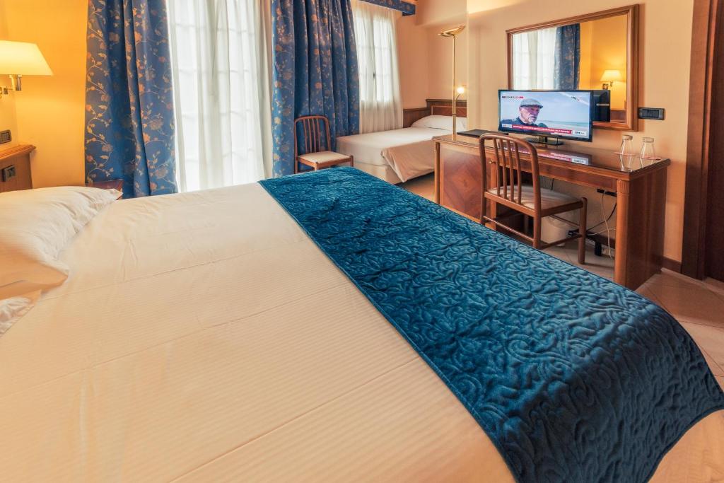 Postel nebo postele na pokoji v ubytování Hotel Bettina