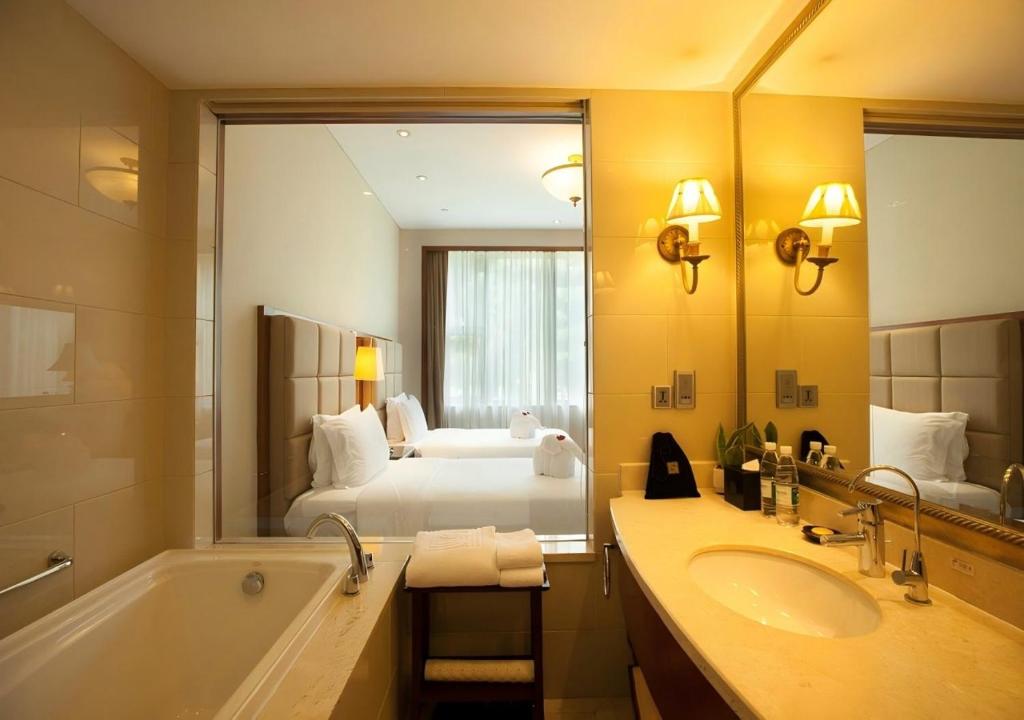 Postel nebo postele na pokoji v ubytování Seaview Resort Xiamen