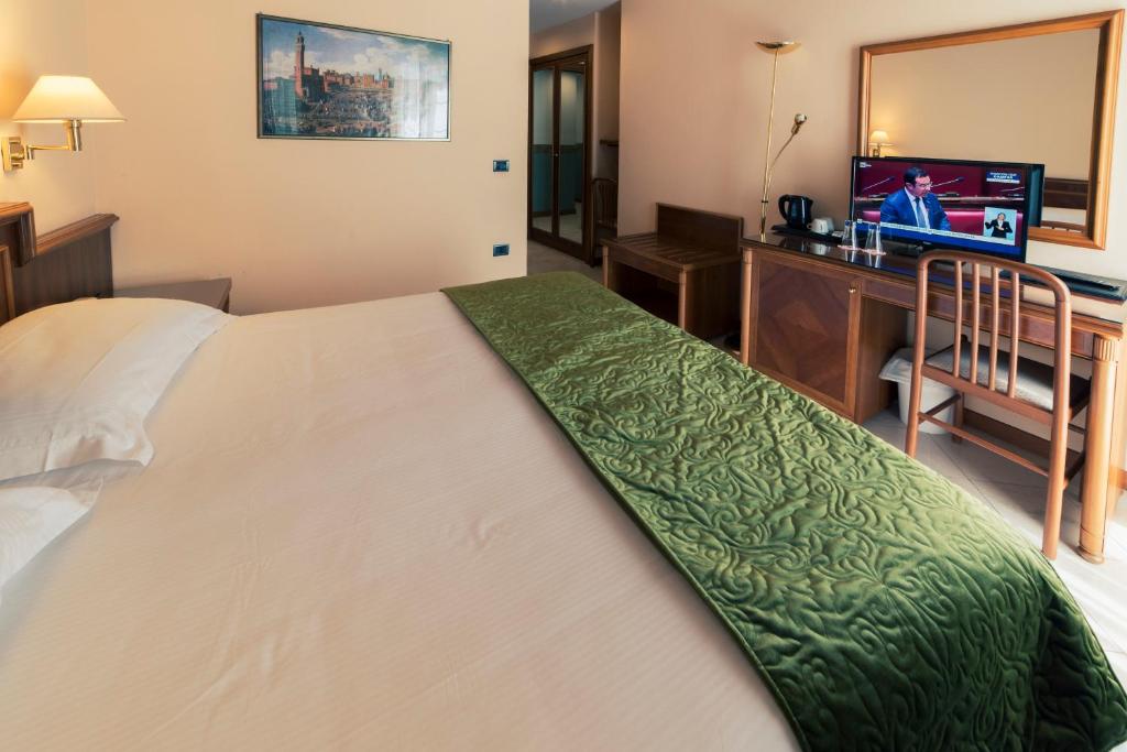 Postel nebo postele na pokoji v ubytování Hotel Bettina