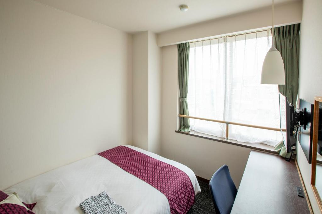 Postel nebo postele na pokoji v ubytování Hotel Claire Higasa