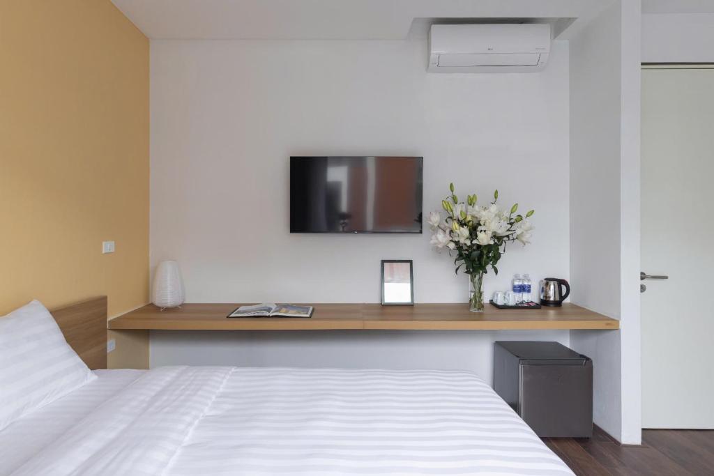 Ένα ή περισσότερα κρεβάτια σε δωμάτιο στο BeeSpace Coworking & Apartment