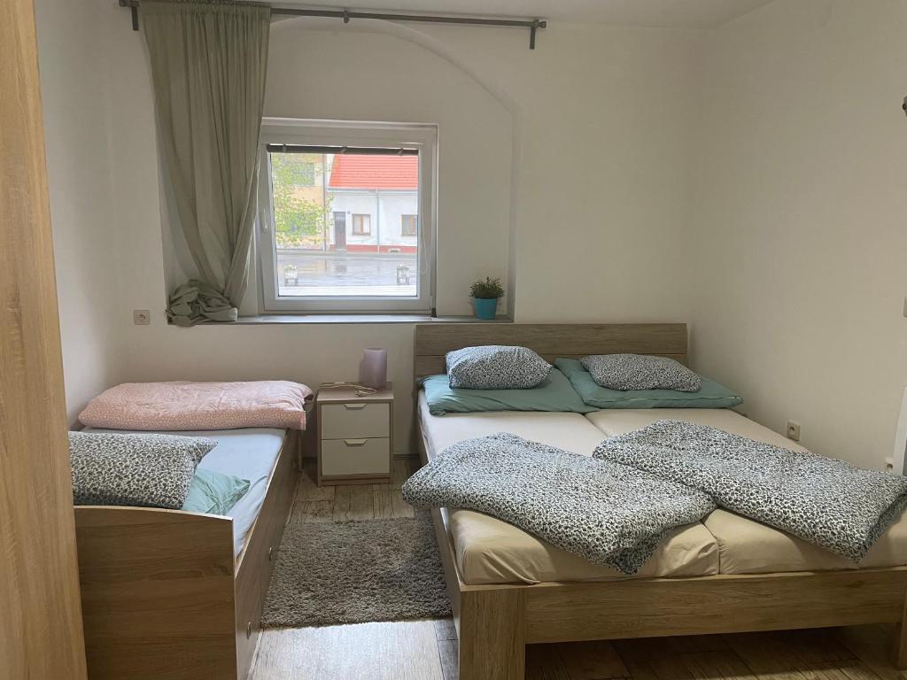 Postel nebo postele na pokoji v ubytování Penzion u Formana