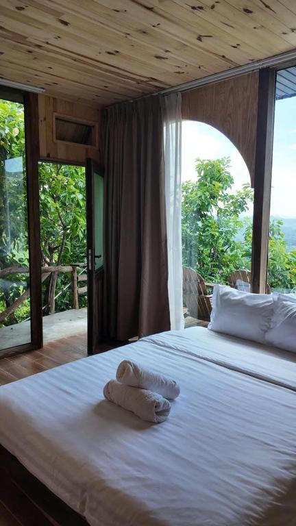 Postel nebo postele na pokoji v ubytování Mimoza homestay, Cầu Đất - Đà Lạt