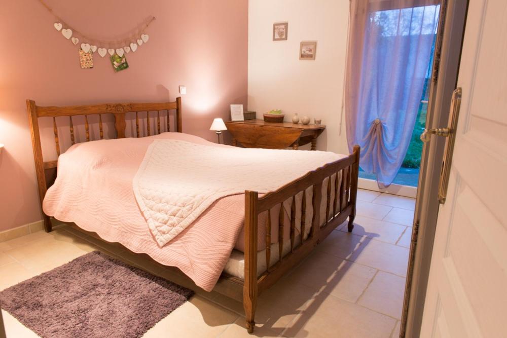 Postel nebo postele na pokoji v ubytování Chambres d'hôtes Ferme du Feugrès