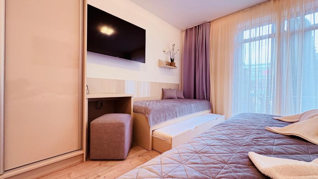 Posteľ alebo postele v izbe v ubytovaní Apartmán ELIZABETH