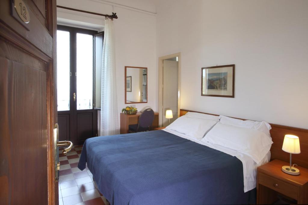 Cama o camas de una habitación en Villa Astoria